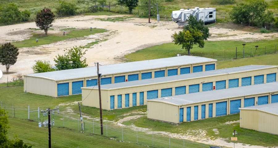 Aerial view of RV and boat parking beside the storage buildings in Rockdale, TX