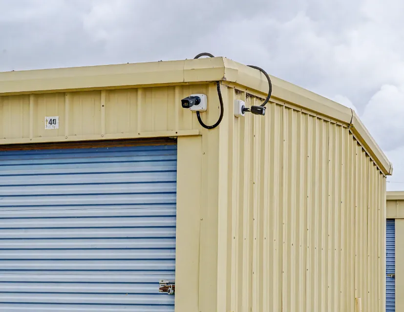 Security camera mounted on a storage building at Spearhead Storage in Rockdale, TX